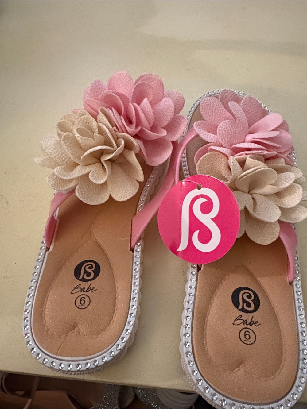 bebe Pink and Cream Floral Rhinestone Flip Flops - Women's